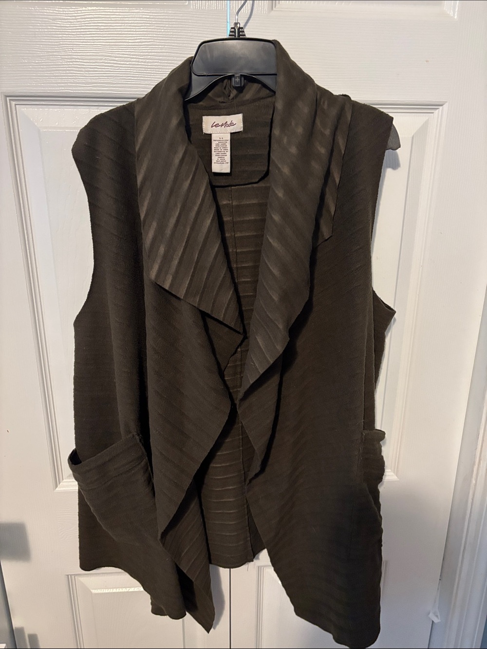 Sleeveless vest. Fits one size. Olive green. From cracker barrel